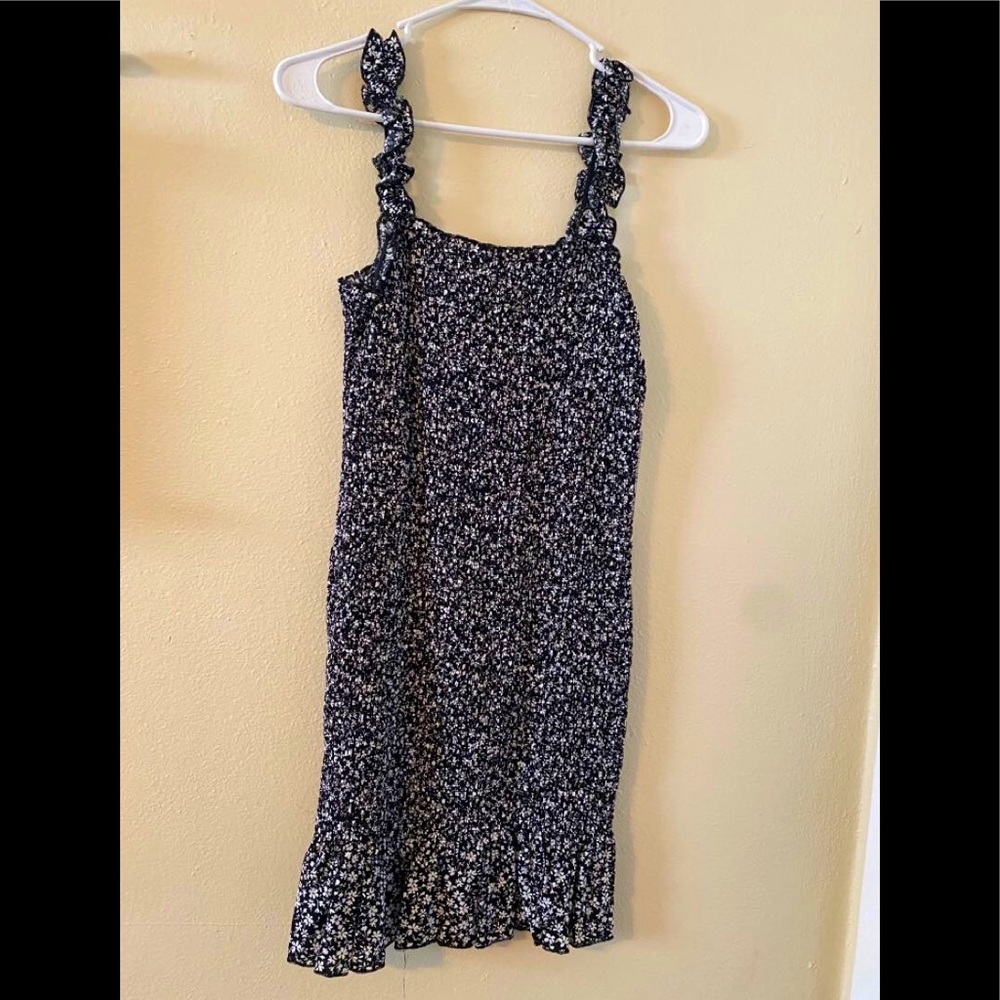 black dress with tiny white floral pattern